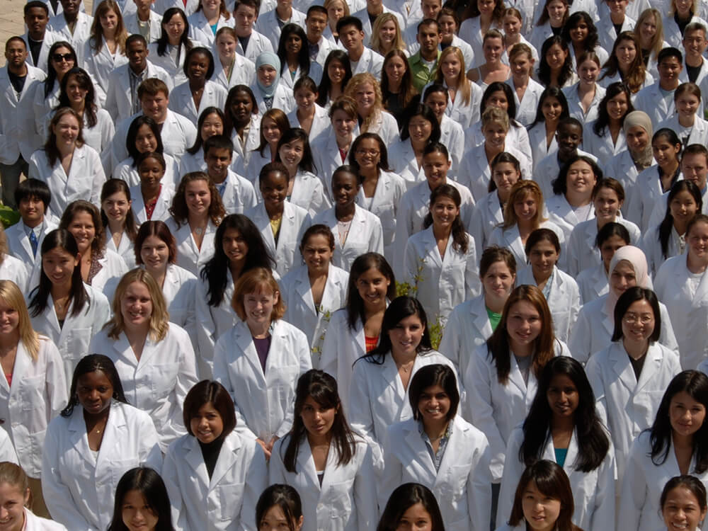 Student pharmacists in whitecoats.